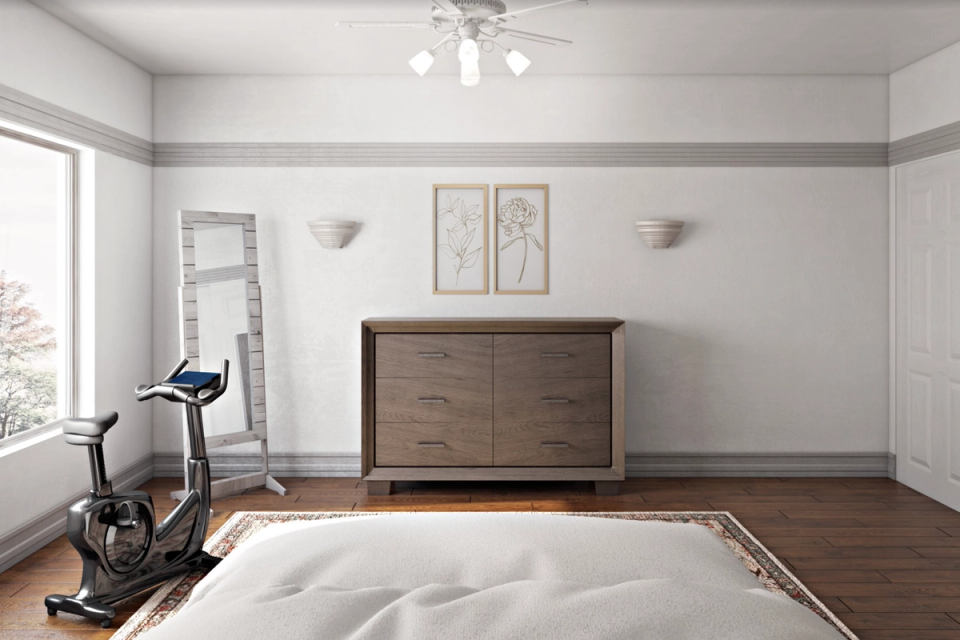 Minimalist home fitness studio with neutral palette, wooden dresser, exercise bike, and natural light from large windows
