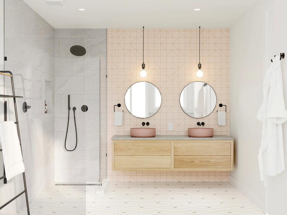 Scandinavian spa with blush tile, natural wood vanity, round mirrors, and pendant lighting