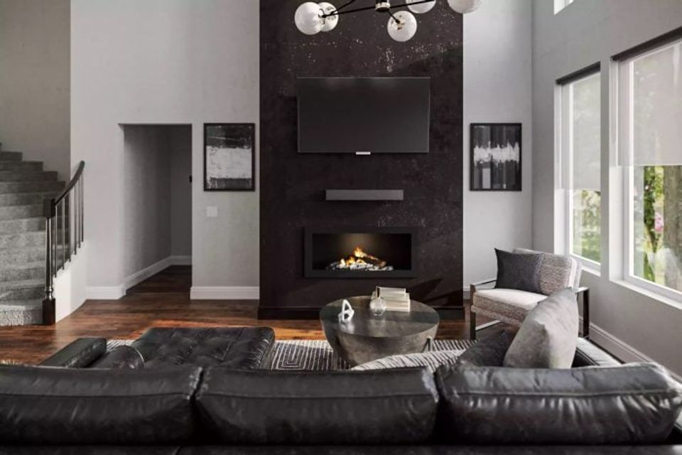 Contemporary living room with black fireplace accent wall, floating TV mount, black leather sectional, and minimalist lighting for bold sophistication