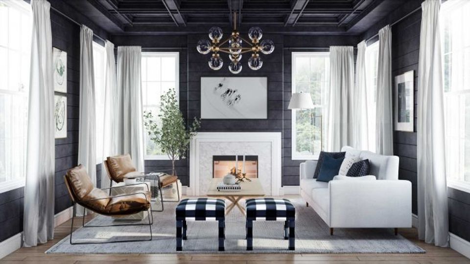 Dramatic black ceiling with white fireplace, navy and cream furnishings, and classical gold chandelier create sophisticated contrast