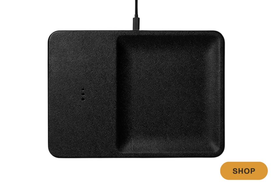 Minimalist black charging pad with dual compartments for sleek desk organization