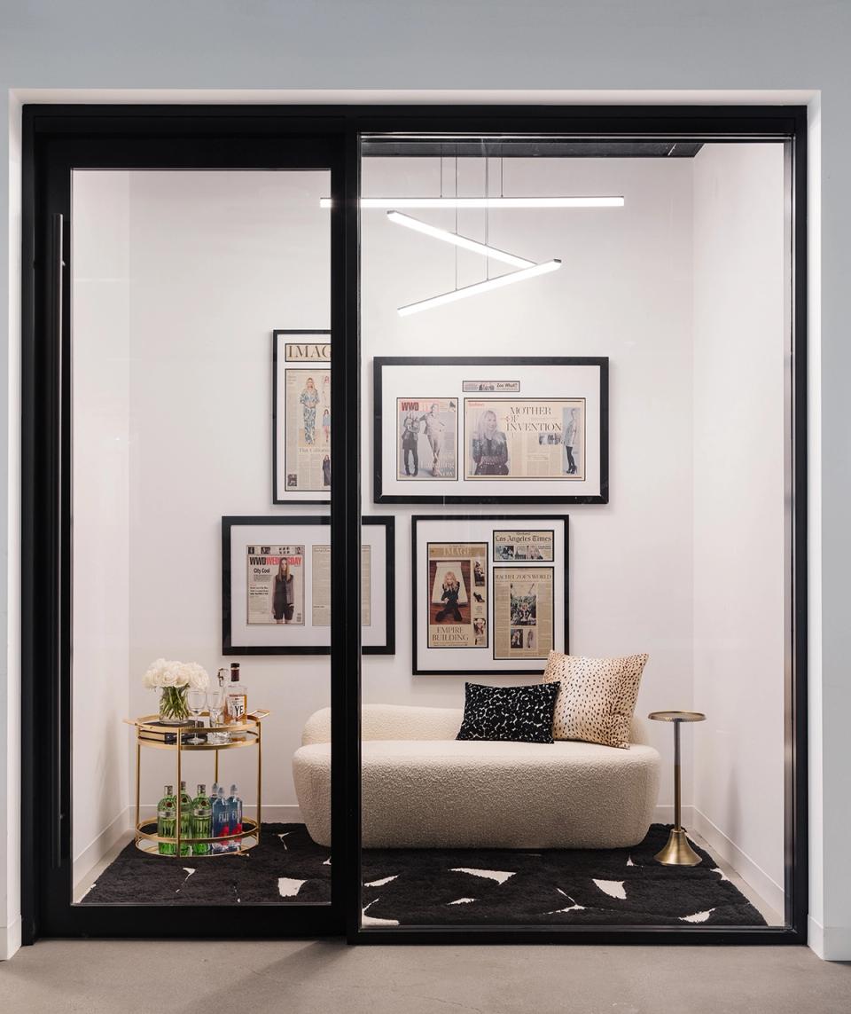 Glamorous dressing room nook with black framing, gallery wall, and sophisticated styling