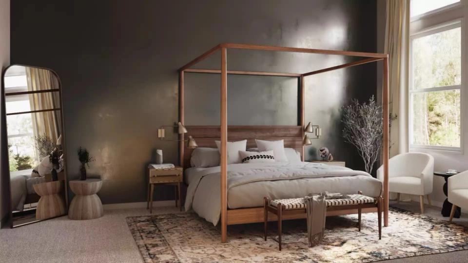 Moody bedroom with deep taupe walls, wooden canopy bed, and warm vintage-inspired lighting