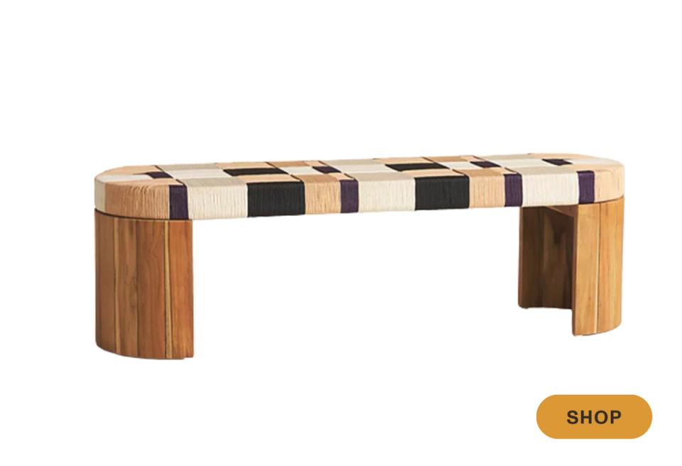 Mid-century modern bench with wooden base and upholstered checkerboard seat in neutral palette