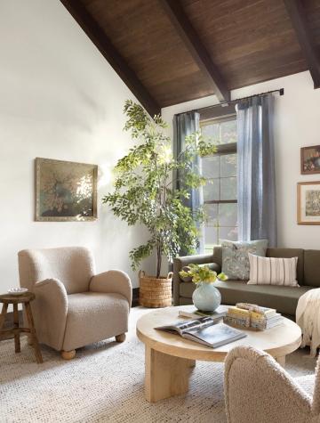 Bright coastal interior with vaulted ceilings, organic textures, and earthy neutral palette