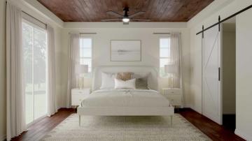 Bright Scandinavian bedroom with white bed, warm wood ceiling, neutral palette, and minimalist decor creating calm, airy atmosphere