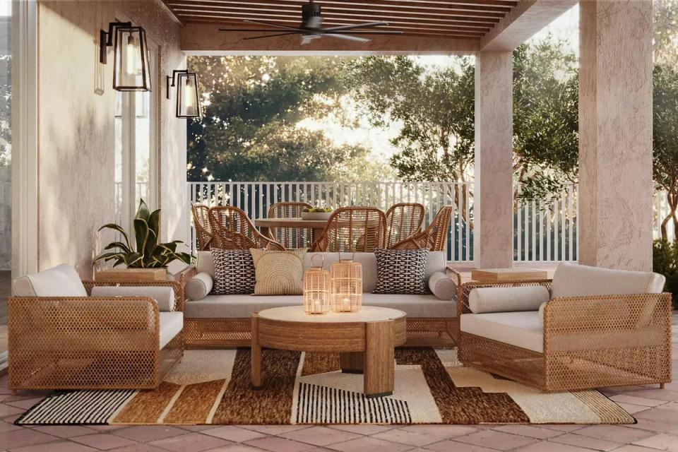 Warm contemporary outdoor lounge with rattan sectional, natural wood tones, and earthy aesthetic
