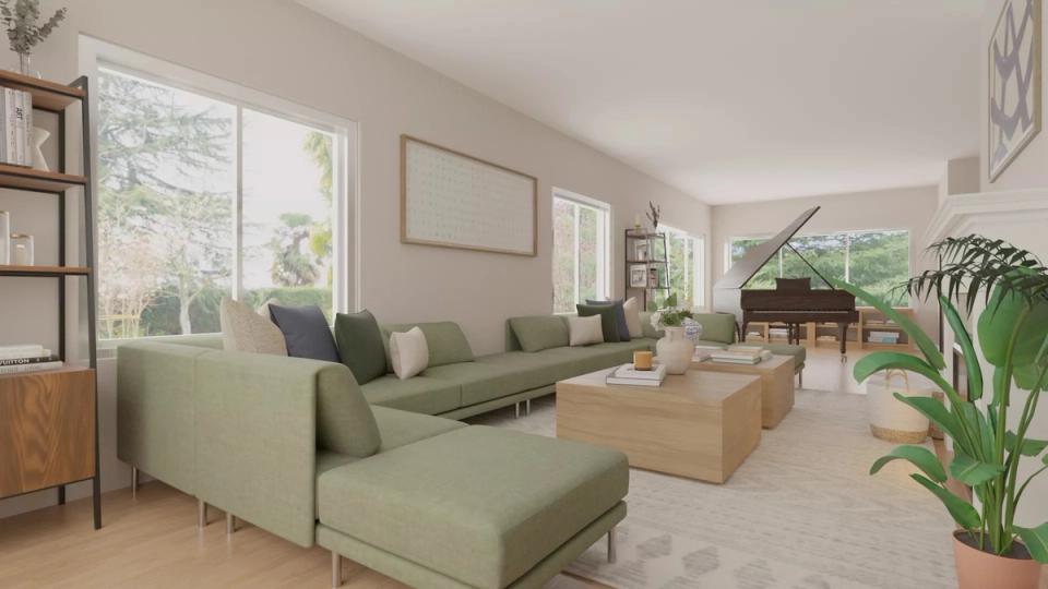 Modern open-concept living room with sage green sectional, natural wood accents, and abundant natural light creating calm aesthetic