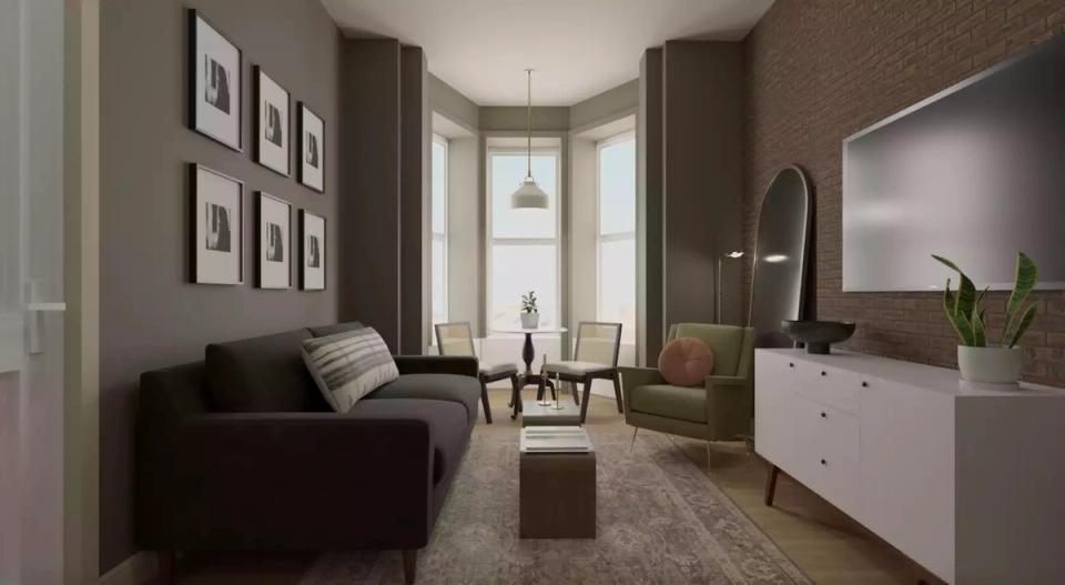 Refined dark academia bedroom lounge with soft taupe walls, black furnishings, and gallery wall art