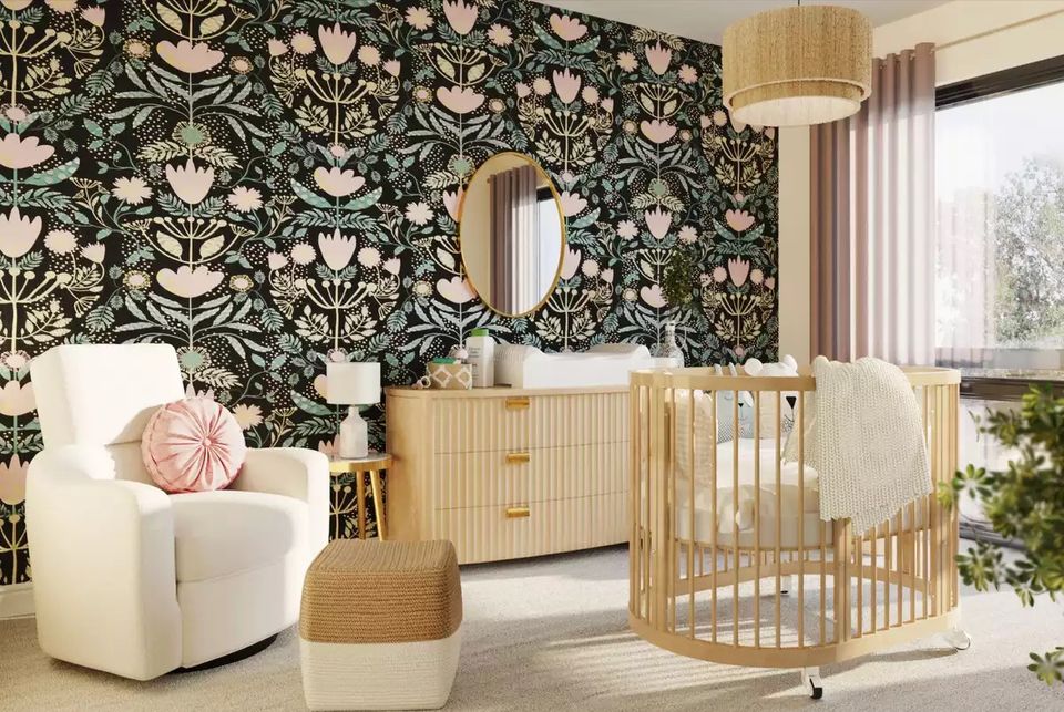 Sophisticated nursery with dark botanical patterned accent wall, natural wood elements, cream furnishings, and soft neutral tones