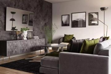 Mid-century living room with textured dark accent wall, gray upholstery, chartreuse accents, and black geometric art for bold, balanced design.
