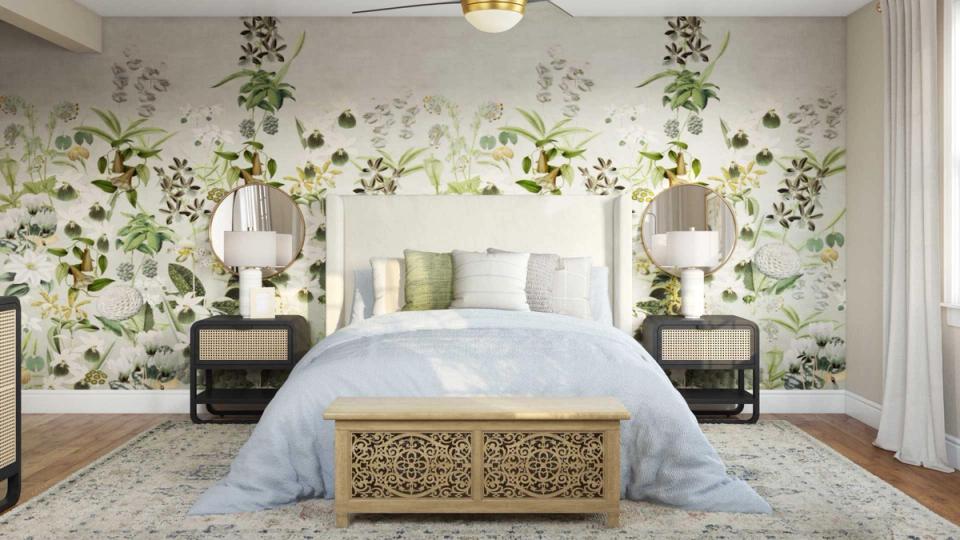 Serene bedroom with botanical wallpaper, sage green accents, and natural light