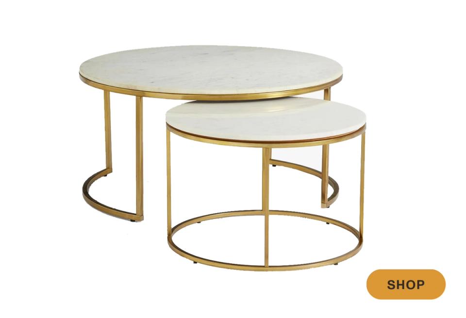 Nesting round tables in brass with marble tops, contemporary glam aesthetic