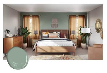 Tranquil bedroom with soft sage green accent wall, warm wood mid-century bed, and golden curtains evoking peaceful, earthy elegance