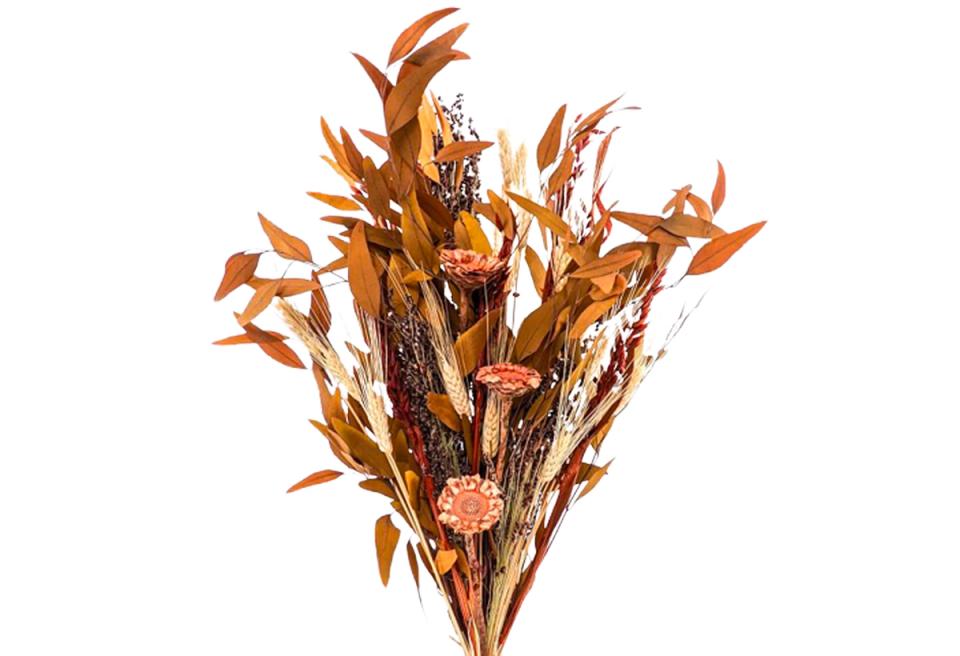 Warm terracotta dried bouquet with layered textures and botanical richness