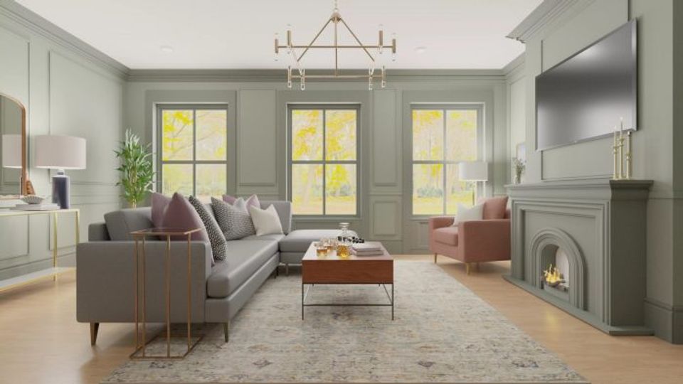 Elegant sage green living room with fireplace, mulberry accents, and soft natural lighting creating a warm, balanced traditional-modern space.