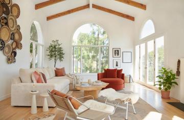 Airy Scandinavian living room with warm wood tones, neutral palette, and terracotta accents