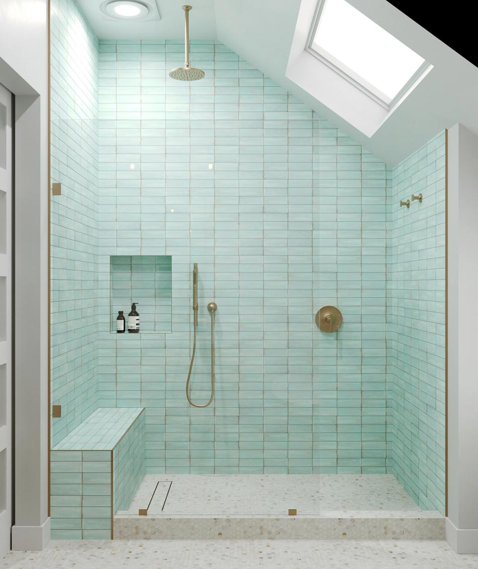 Serene coastal shower with seafoam green subway tile, skylight, and light wood accents