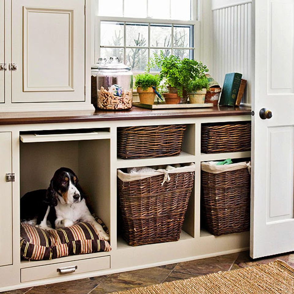 Bright storage unit with dog crate nook and woven baskets, light and airy