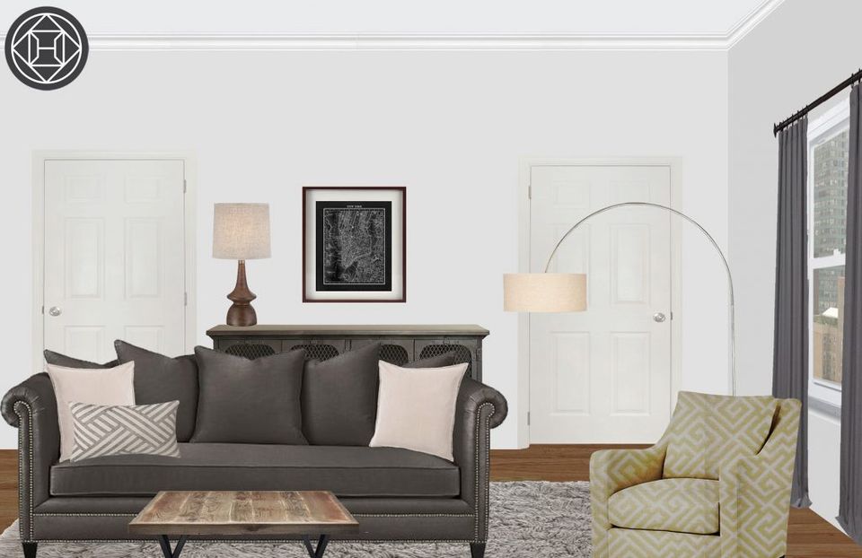 Eclectic sitting area with rolled-arm sofa, patterned accent chair, and gallery wall styling