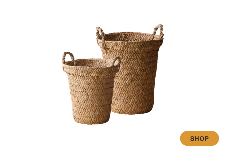 Natural woven seagrass baskets with handles in warm neutral tones