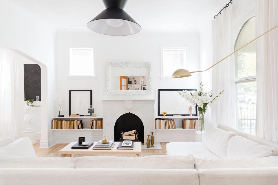 Scandinavian home office with clean lines, black pendant, and minimalist storage with botanical accents