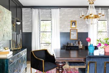 Eclectic modern home office with bold teal and navy walls, black desk, brass accents, and colorful contemporary touches