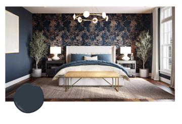 Luxe navy bedroom with ornate damask wallpaper accent wall, brass chandelier, and warm wood tones creating elegant sophistication