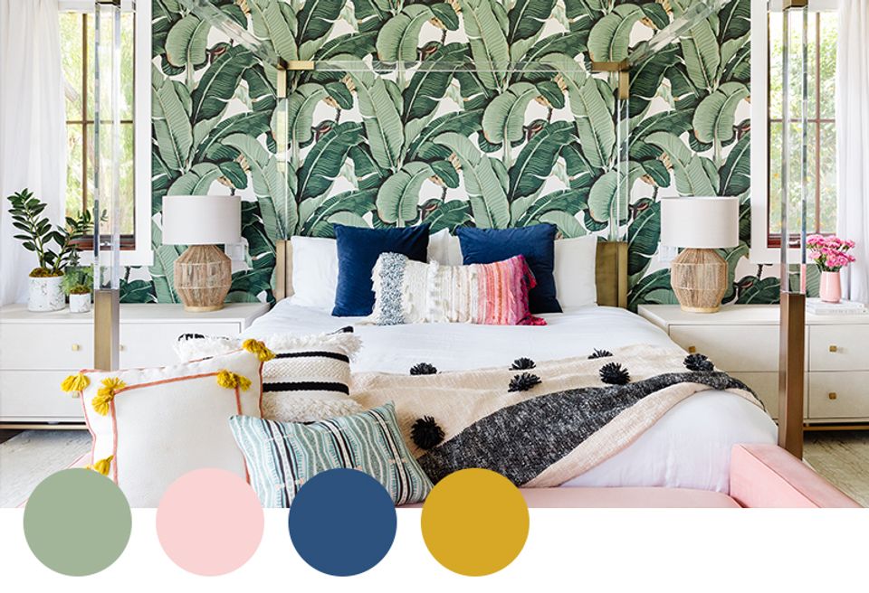 Tropical bedroom with banana leaf wallpaper, navy and yellow accents