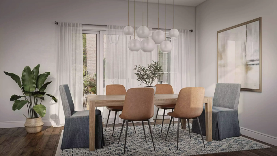 Contemporary dining with natural wood table, cognac leather chairs, layered pendant lights, and serene palette