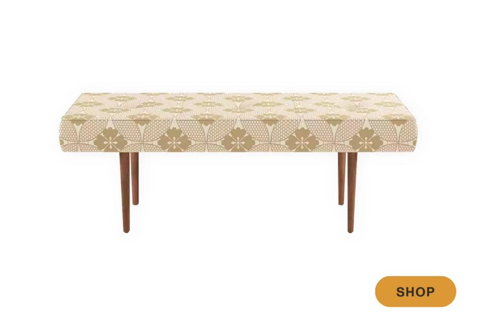 Mid-century bench with cream botanical print and warm wood legs