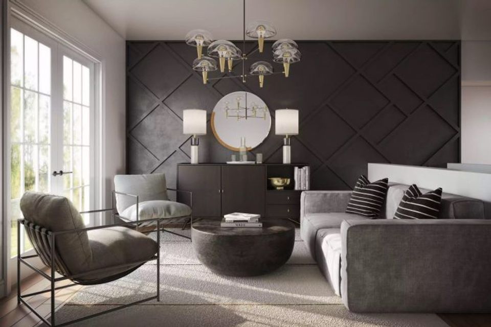 Contemporary living room with charcoal diamond-patterned accent wall, gray upholstery, and brass lighting fixtures