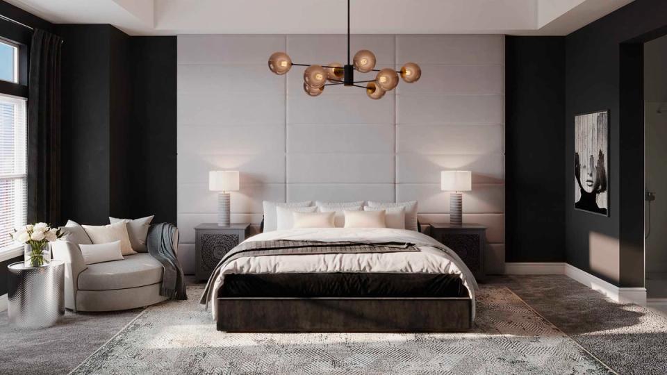 Glamorous dark bedroom with black accent walls, sculptural copper pendant, and neutral luxury bedding