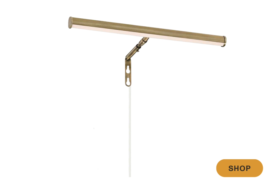 Industrial brass bar sconce with minimalist articulating joint design