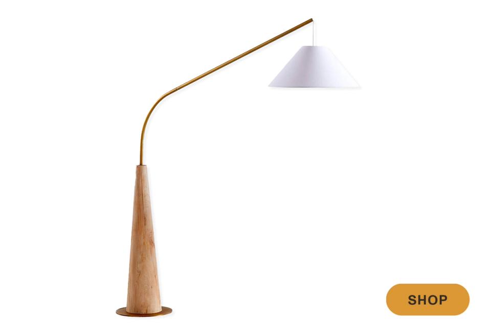 Scandinavian arc floor lamp with natural wood base and pale blue shade