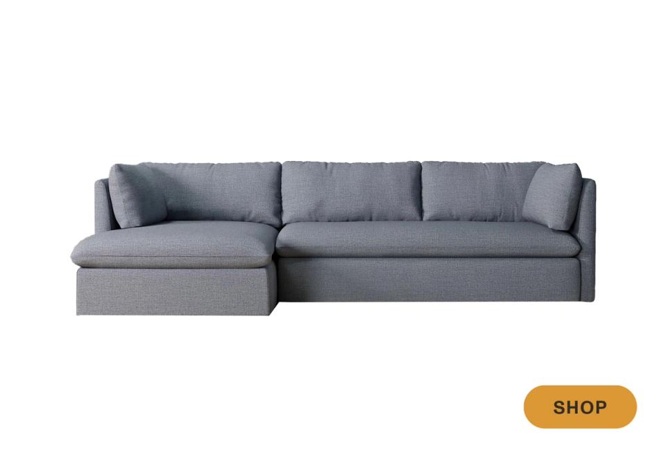 Modern gray linen sectional sleeper with low-profile frame and storage