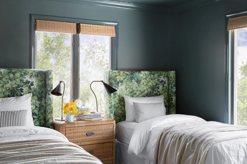 Tranquil teal bedroom with natural wood accents, botanical headboards, and bright coastal calm