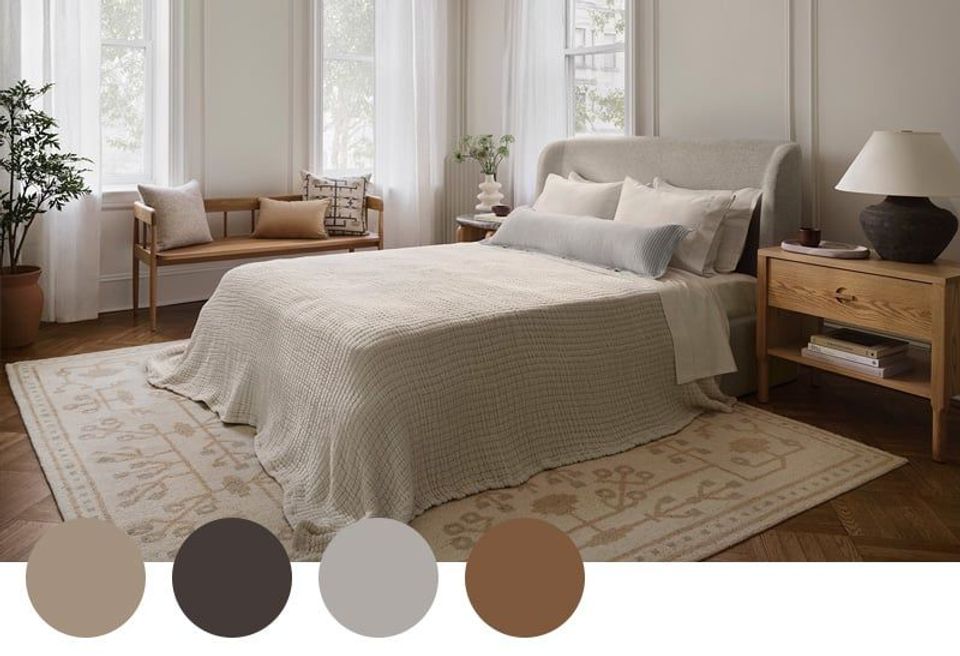 Serene neutral bedroom with warm beige tones, natural wood nightstand, soft textures, and abundant daylight creating calming sanctuary