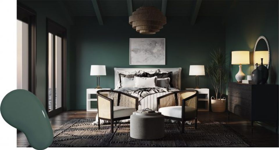 Luxe bedroom featuring deep forest green walls, modern black bed frame, and warm brass accents for dramatic sophistication