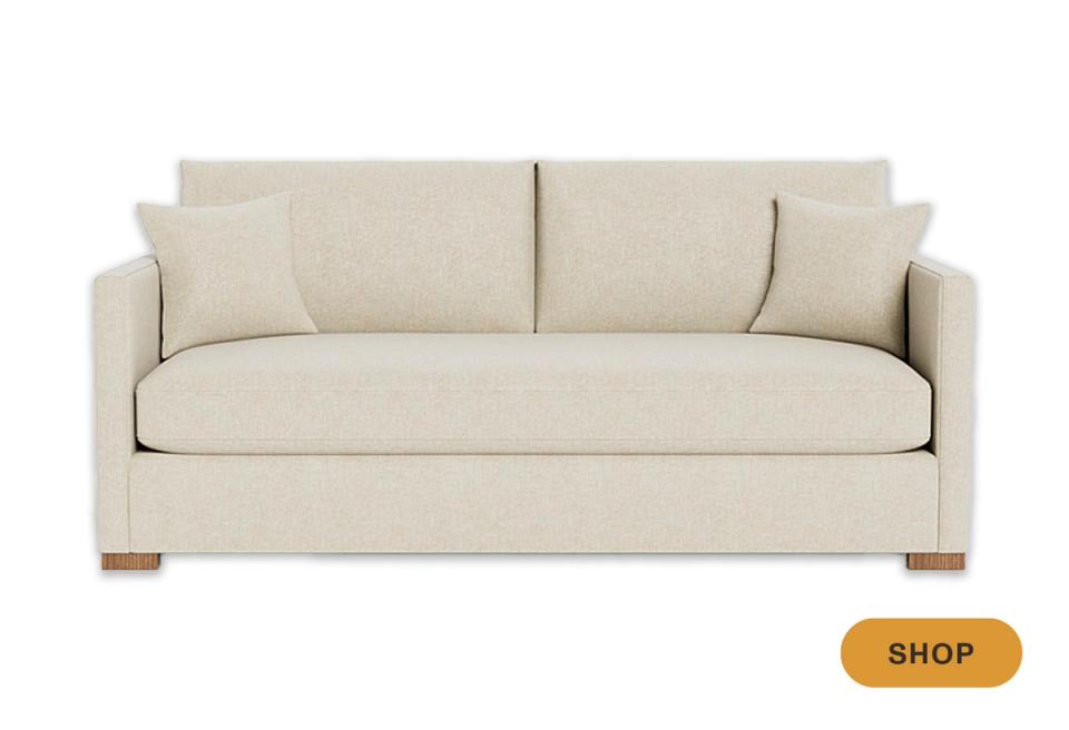 Transitional camel-tone sofa with clean lines, wooden feet, and understated elegance