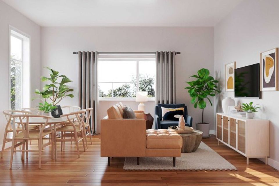 Scandinavian-inspired living room with cognac leather, natural wood, and soft neutral palette