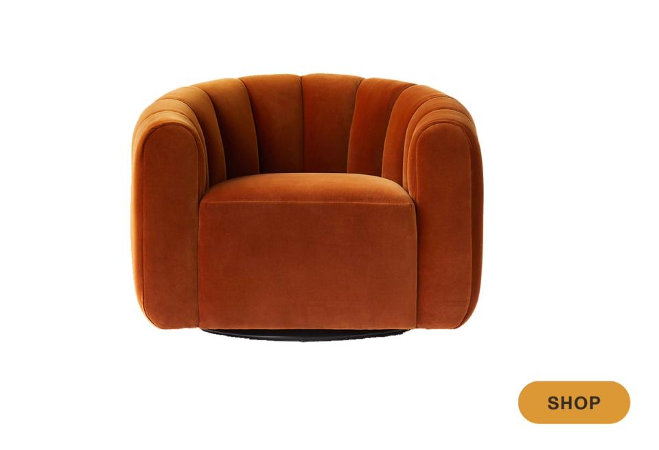 Art deco burnt orange swivel chair with channeled back and glamorous styling