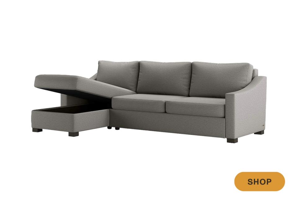 Transitional sage green sectional sleeper with lift-top storage ottoman