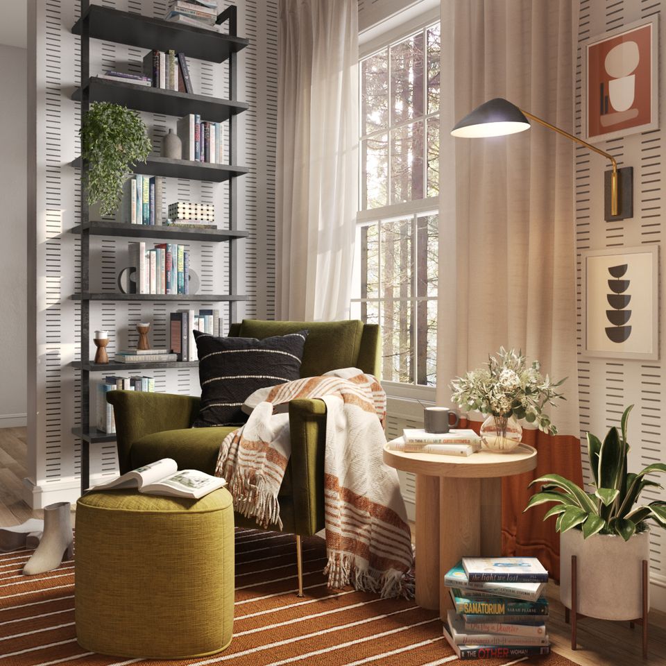 Mid-century modern reading space with olive green chair and warm neutral wallpaper