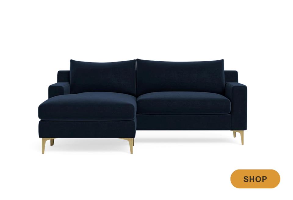 Contemporary navy velvet sectional with tapered wooden legs and clean lines