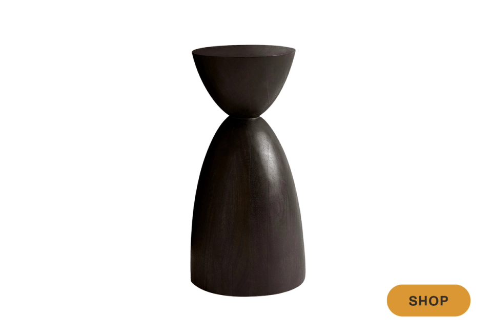 Contemporary sculptural martini table with hourglass silhouette in dark matte finish