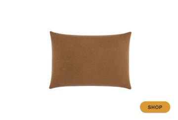 Caramel-toned rectangular throw pillow with soft texture
