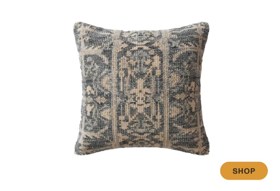 Neutral throw pillow with geometric damask pattern in gray and cream tones