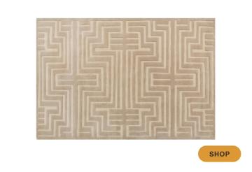 Contemporary tan and cream area rug with minimalist geometric Greek key pattern