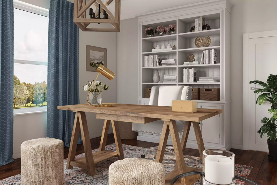 Bright Scandinavian office with natural wood desk, built-in shelving, and serene neutral palette